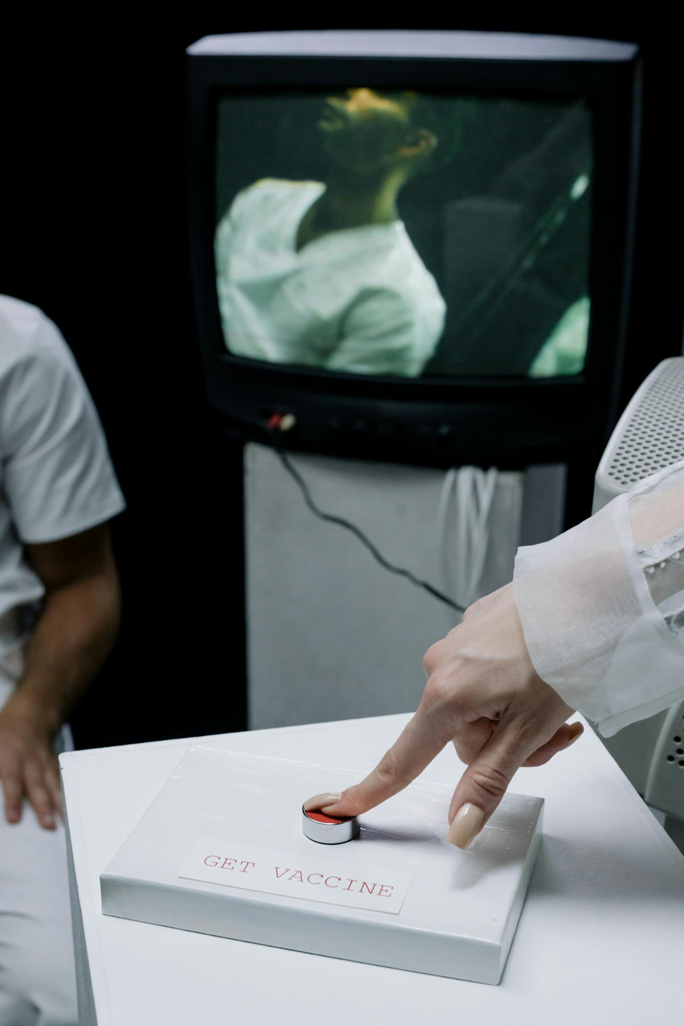 A laboratory scene with emphasis on vaccine technology and a button labeled 'Get Vaccine'.